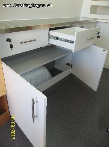 
Implementacin para una Veterinario Mvil. Muebles en Tableros Aglomerado Blanca y Cubierta en Acero Inoxidable. Sistema de Agua Potable y Agua Servida con Estanques y Bomba de agua. Lavamano en Acero inoxidable. Mueble con Cajones para las Utilidades. Puertas y Cajones con Chapa para evitar su apertura en el Transito. Canil en Tableros resistente a la Humedad. Instalacin Elctrica en 12V (Alimentacin interna) y 220V (Alimentacin externa).