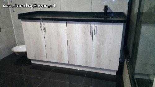 Mueble de Bao en Tableros Color Toscana y Cubierta de granito negro. con Lavamano bajo cubierta. 